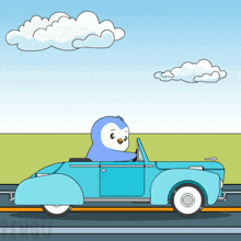 a cartoon penguin is driving a blue car on the road