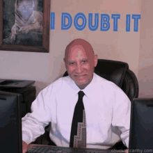 a man sitting at a desk with a picture of a tiger behind him and the words i doubt it above him