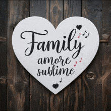 a heart shaped sign with the words family amore sublime on it