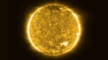 a close up of the sun on a dark background .