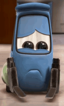 a blue cartoon car with a sad face on it