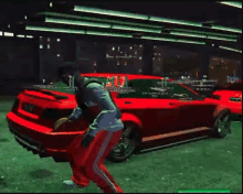 a man in red pants is standing in front of a red car in a video game .