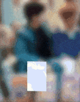 a blurred image of a person 's face with a square in the middle