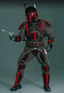 a man in a black and red armor holds a gun