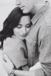 a black and white photo of a man hugging a woman with pixverse.ai in the upper right corner