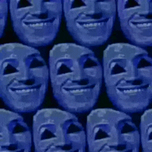 a bunch of blue masks are lined up in a row and smiling .