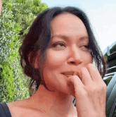 a close up of a woman 's face with the word cherry on top