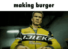 a man wearing a yellow jacket with the word racing on it