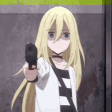 a girl with long blonde hair is pointing a gun at the camera .