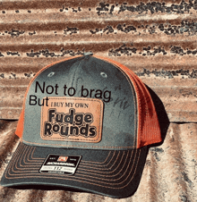 a hat that says ' not to brag but i buy my own fudge rounds ' on it