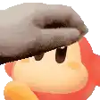 a person is petting a cartoon character 's head with a glove .
