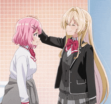 a girl with pink hair is being comforted by another girl