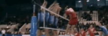 a blurred image of a volleyball game with a player wearing the number 20