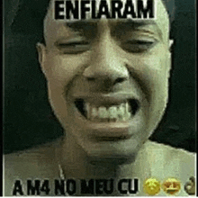 a close up of a man 's face with a caption that says enfiaram a m4 no meu cu .