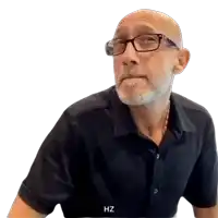 a man wearing glasses and a black shirt has the letters hz on the bottom