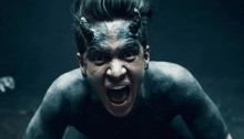a man with horns painted on his face screams