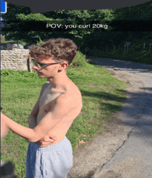 a picture of a shirtless young man with the caption " pov you curl 20kg "