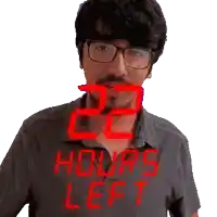 a man wearing glasses and a shirt that reads 22 hours left