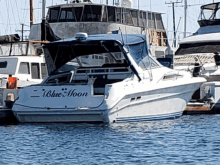 a boat with the name blue moon on the back of it