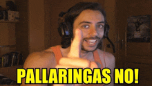 a man wearing headphones is pointing at the camera with the words pallarings no on the bottom