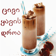 two glasses of chocolate milkshake with whipped cream on top and straws