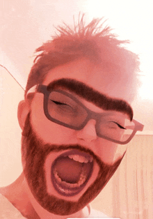 a man with glasses and a beard screams with his mouth open