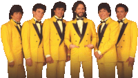 a group of men in yellow suits and bow ties pose for a picture