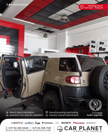 a toyota fj cruiser is being worked on in a car planet store