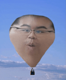 a hot air balloon with a man 's face in it