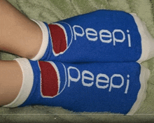 a pair of blue peep socks are on a person 's feet