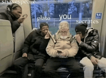 a group of people sitting on a train with the words plato you socrates written on the side