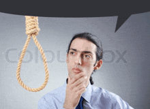 stock image of a man looking at a noose with a speech bubble above him that says colourbox