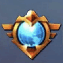 a gold emblem with a blue sphere in the middle .