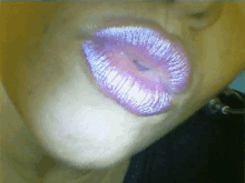 a close up of a woman 's lips with pink lipstick on them