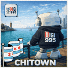 a robot wearing a digi 995 sweatshirt stands on a pier