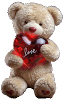 a teddy bear holding a heart that says love on it