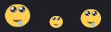 three different sized smiley faces with tears coming out of their eyes on a black background .