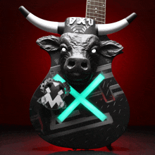 a guitar with a bull head and the word pxu on the top