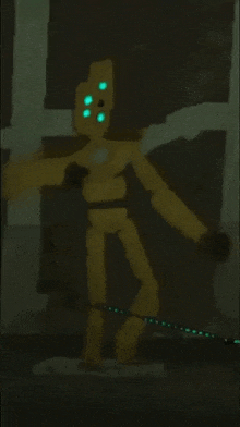 a yellow robot with green eyes is glowing in the dark in a dark room .