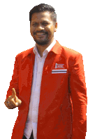 a man wearing a red jacket that says acer on the front