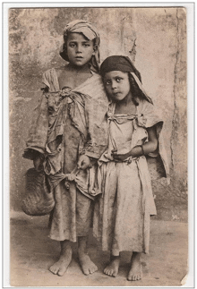 a black and white photo of two children with the number 34 on the bottom right corner