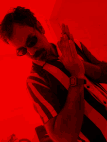 a man wearing sunglasses and a watch that says ' casio ' on the band
