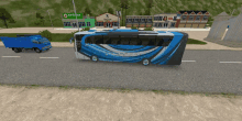 a blue and white bus is driving down a road in front of a pharmacy