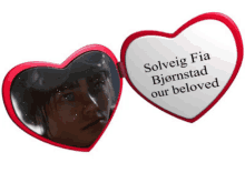 a red heart shaped mirror with the words solveig fia bjornstad our beloved