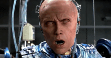 a close up of a robot with his eyes closed and his mouth open