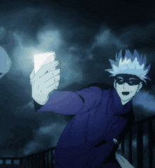 a man in a mask is taking a selfie with a cell phone