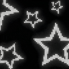 a black background with white stars and arrows