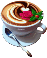 a cup of cappuccino with a pink rose and leaves on top