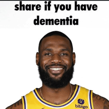 a man with a beard wearing a bibigo jersey smiles