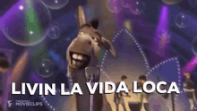 a donkey singing into a microphone with the words livin la vida loca in the background .